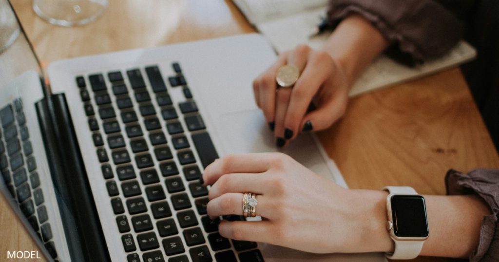 Woman researching on computer