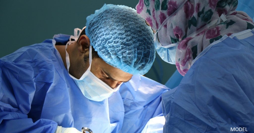 Plastic surgeon performing surgery