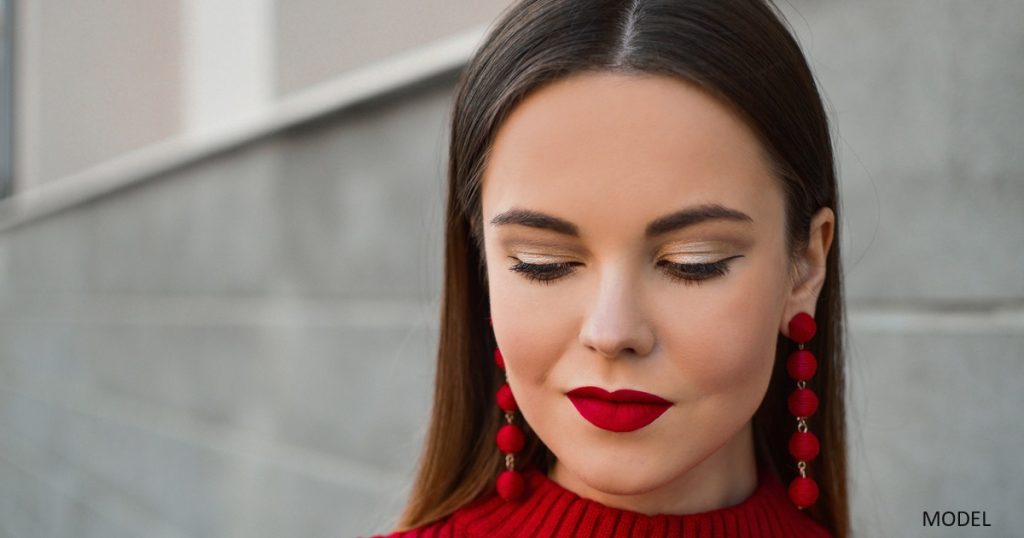 Young woman with red lip