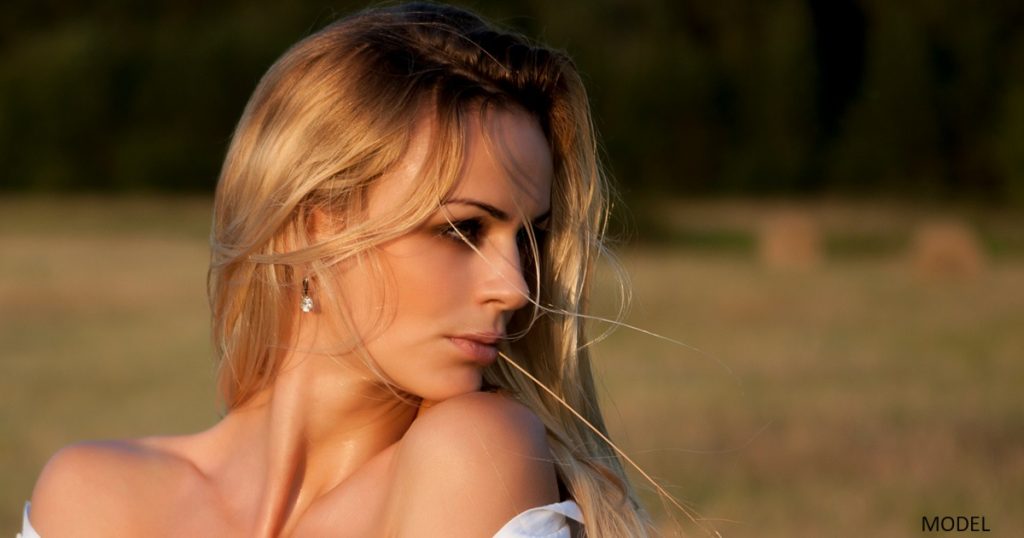 Young woman looking over her shoulder