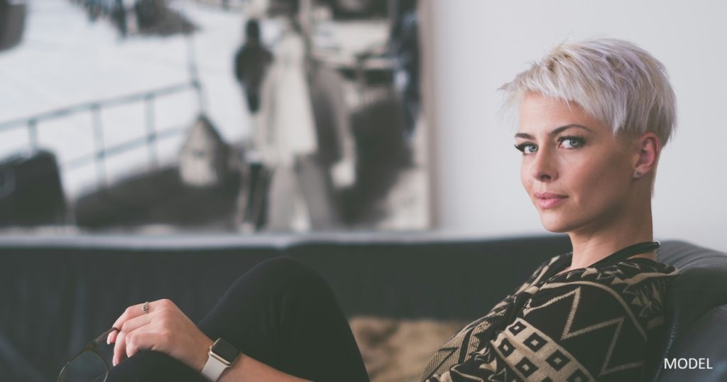 Woman on couch looking at camera