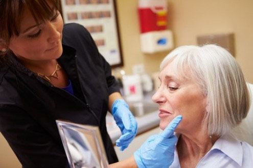 Doctor touching patient's face